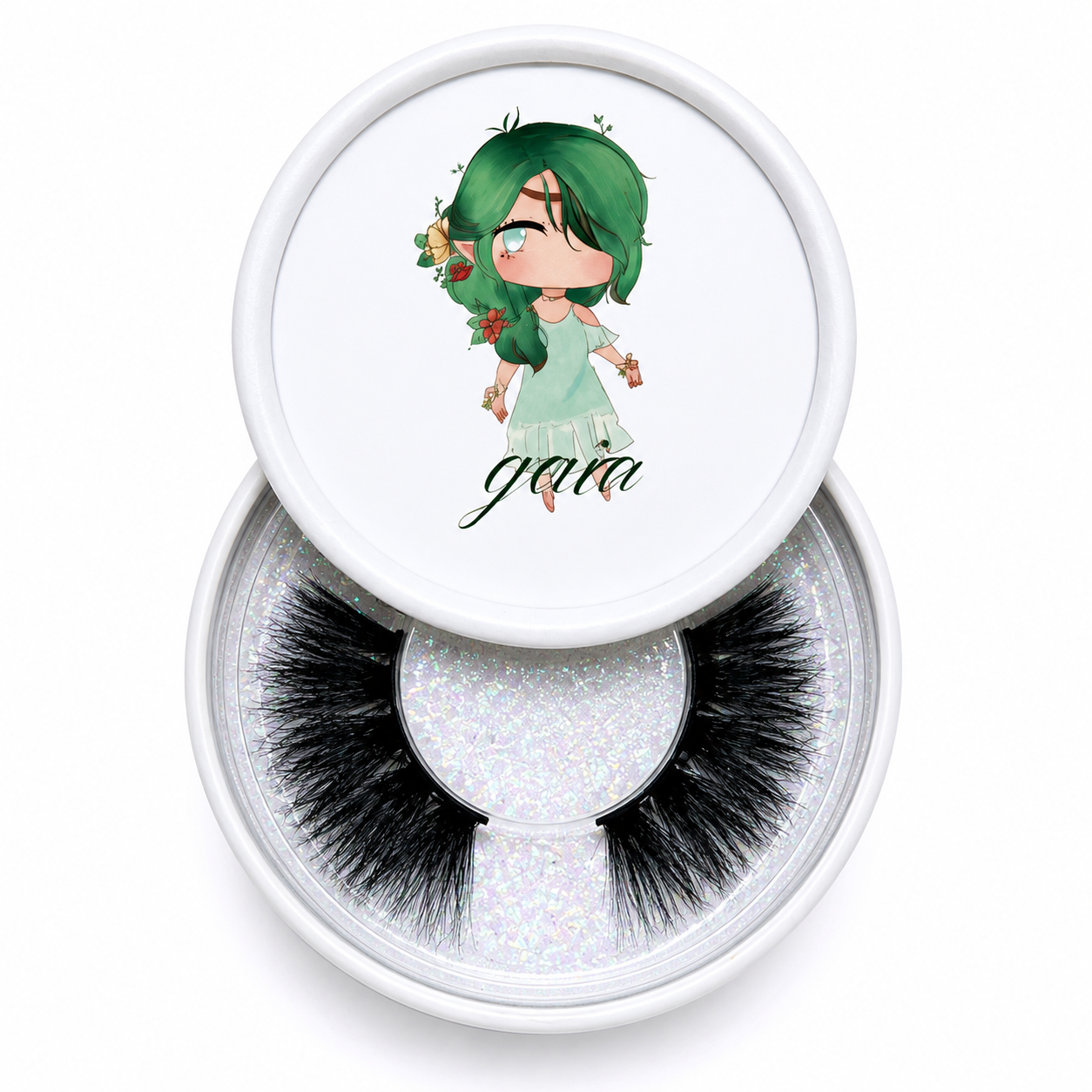Gaia false eyelashes in a clear round case beside an illustrated character lid on a white background