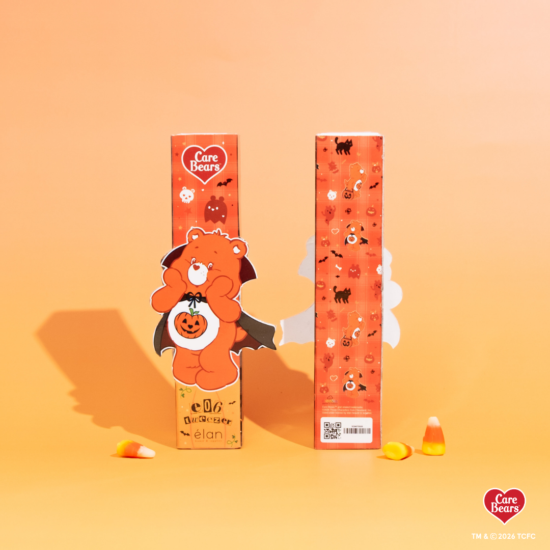 Élan Beauté x Care Bears e06 volume tweezer packaging featuring Friend Bear dressed as a vampire with orange Halloween-themed graphics and candy corn accents.