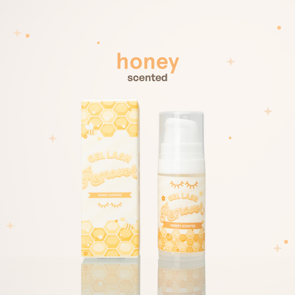Honey scented gel lash remover beside its yellow and white packaging with honeycomb illustrations on it.