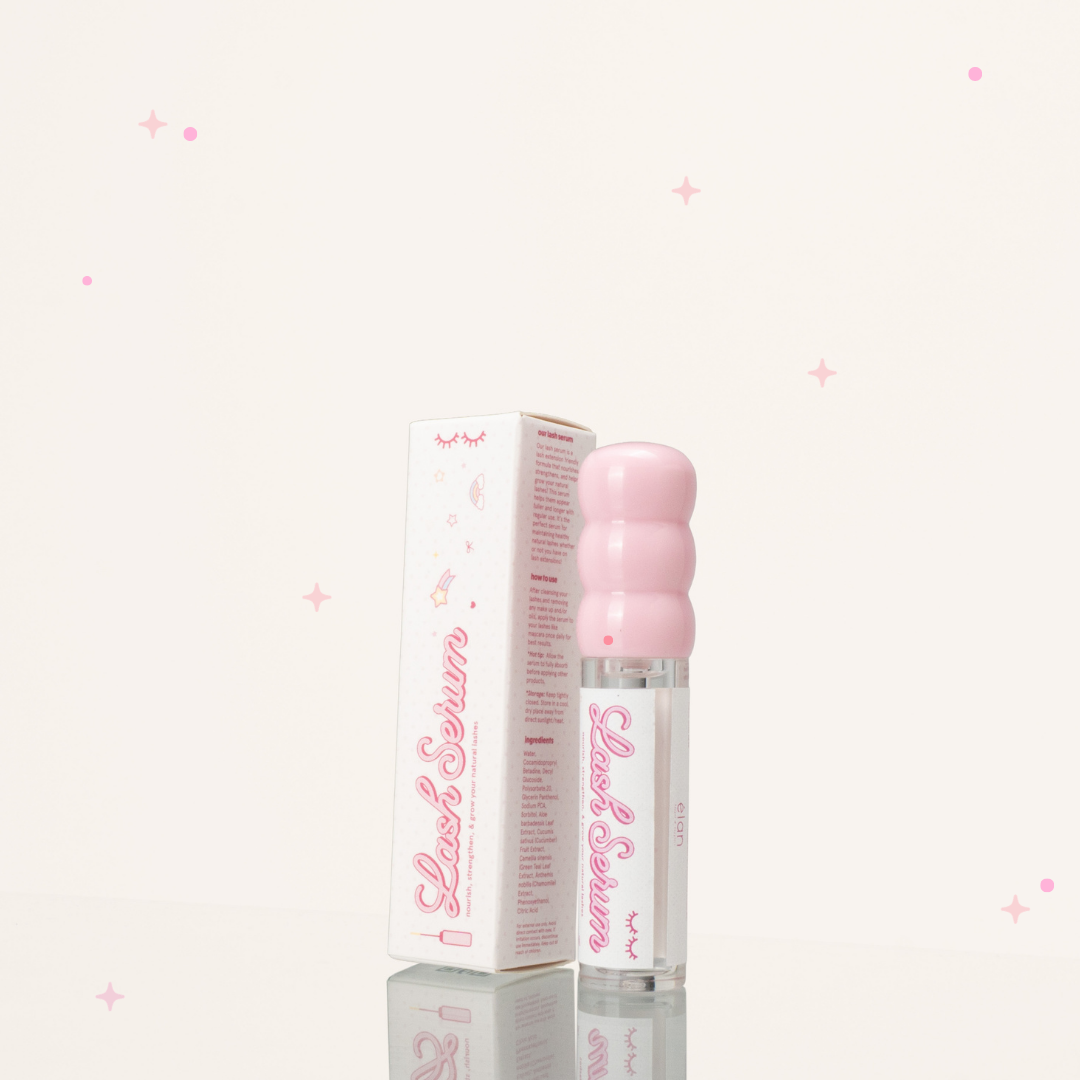 Side view of eyelash growth serum in a clear and pink tube beside its pink-and-white packaging.