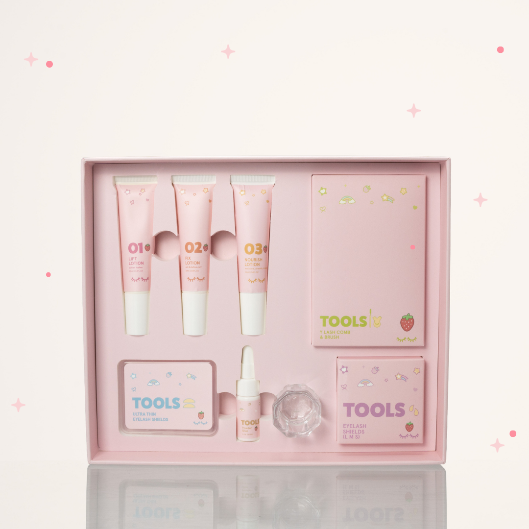 Inside of Strawberry scented Korean Lash Lift Kit with 01 Lift Lotion, 02 Fix Lotion, 03 Nourish Lotion, Y Lash com & Brush, Eyelash shields, Ultra thin lash shields, and Powder glue.