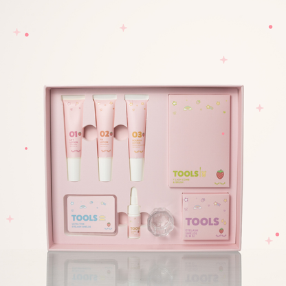 Inside of Strawberry scented Korean Lash Lift Kit with 01 Lift Lotion, 02 Fix Lotion, 03 Nourish Lotion, Y Lash com & Brush, Eyelash shields, Ultra thin lash shields, and Powder glue.