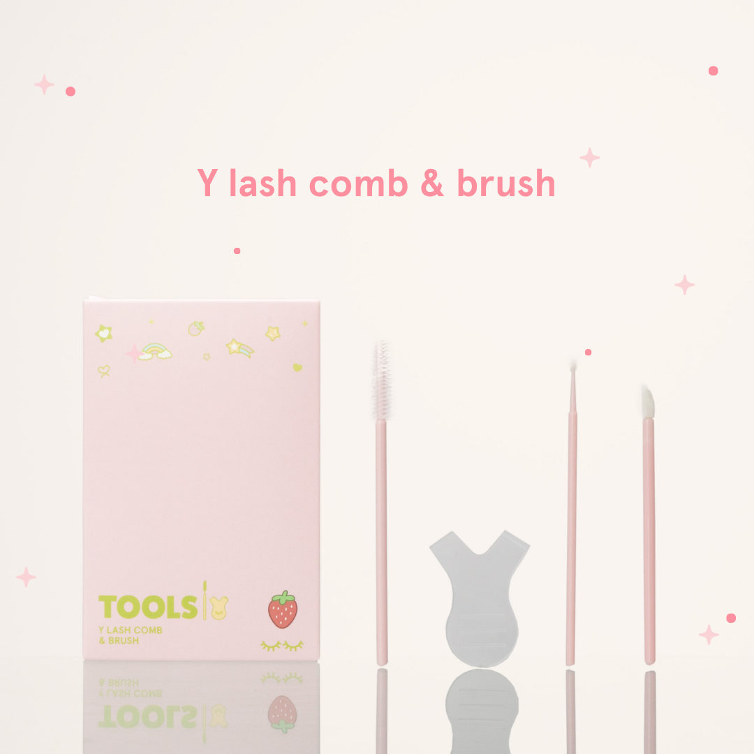 Y lash comb & brush next to its pink packaging with text that says "Tools Y Lash Comb & Brush"