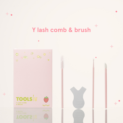 Y lash comb & brush next to its pink packaging with text that says "Tools Y Lash Comb & Brush"