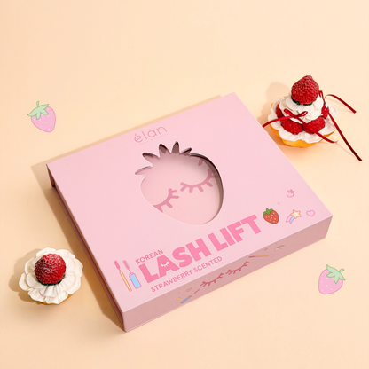 Strawberry scented Korean Lash Lift Kit in its pink packaging with strawberry pastries beside it.