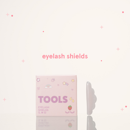 Eyelash shields next to its pink and purple packaging with text saying "Tools Eyelash Shields (L M S)"