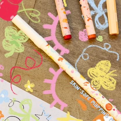 Skin-safe mapping pen with illustrations of an eyelash, butterfly, and flowers.