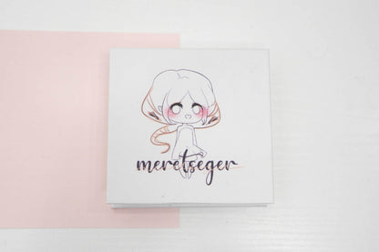 Meretseger false eyelash box featuring an illustrated character on a white and pale pink background.