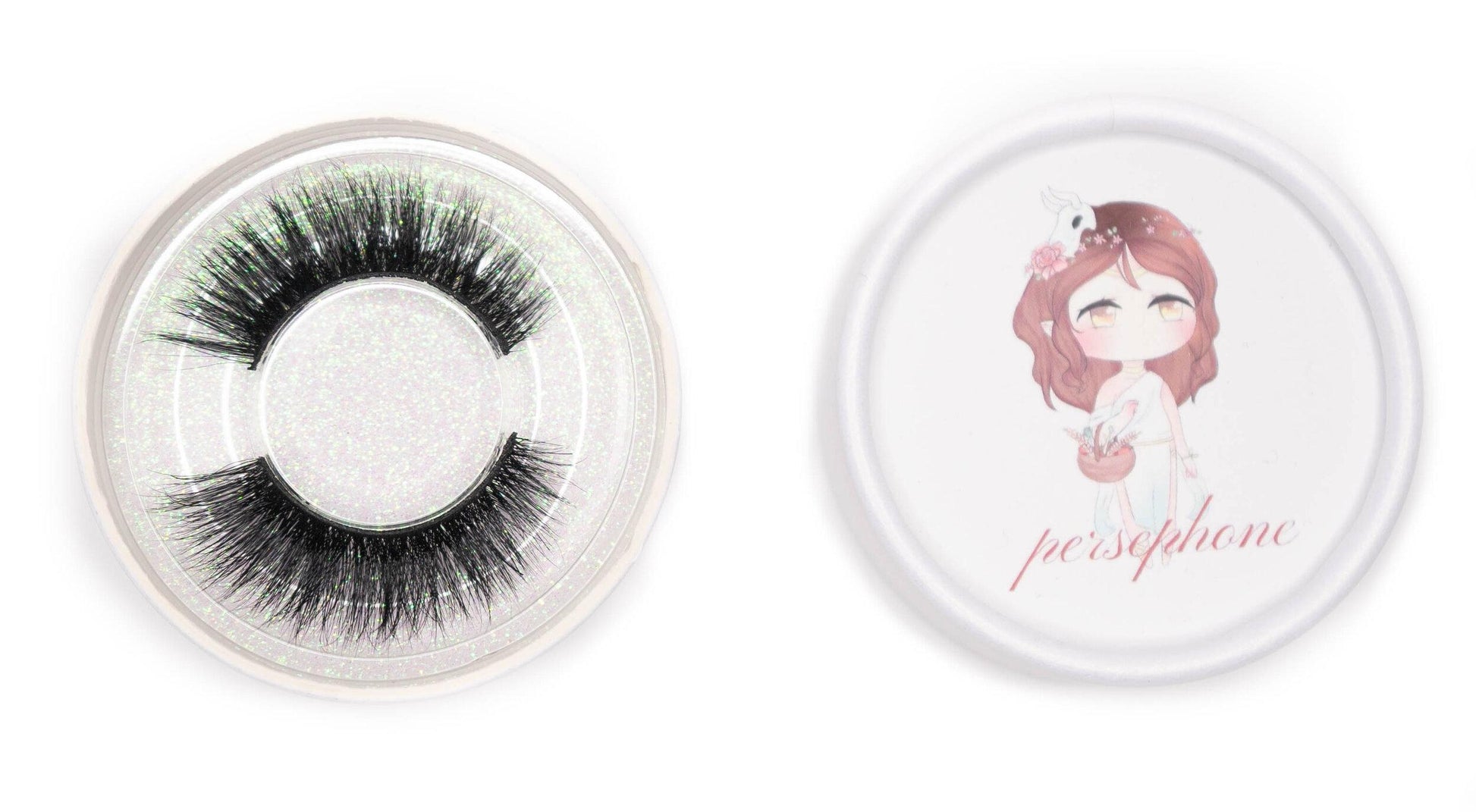 Persephone false eyelashes in a clear round case beside the illustrated Persephone product lid on a white background.