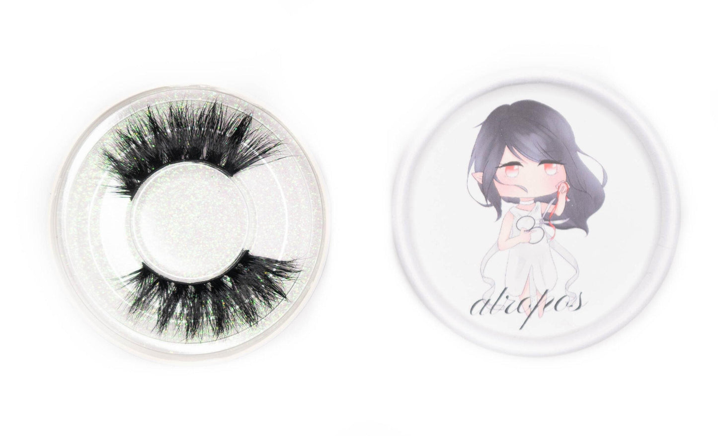 Alropos false eyelashes in a clear round case beside the illustrated Alropos product lid on a white background. 