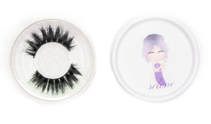 Selene false eyelashes in a clear round case beside the illustrated Selene product lid on a white background.