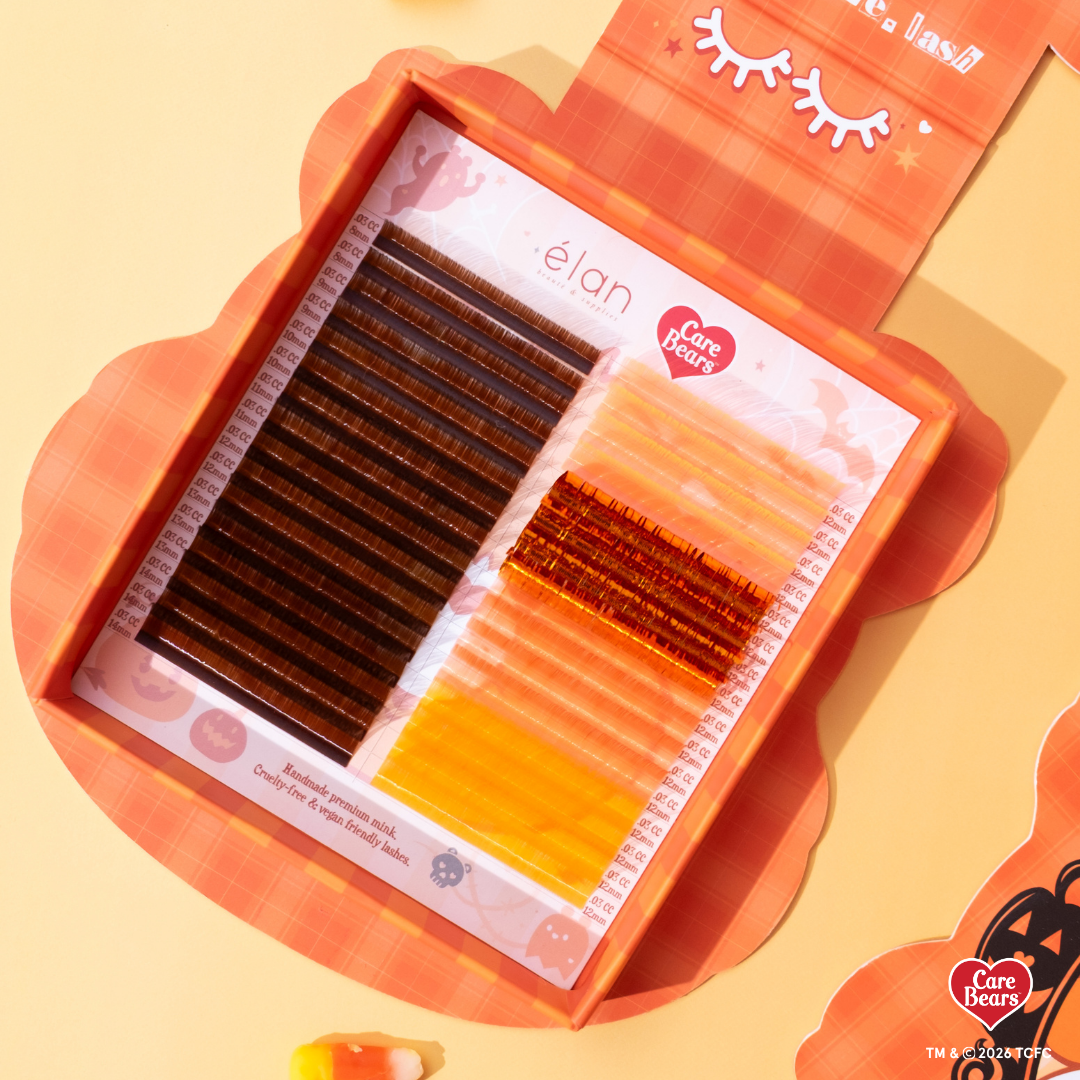 élan beauté x Care Bears Halloween Collection featuring brown, orange, and yellow lash extensions in festive orange seasonal packaging.