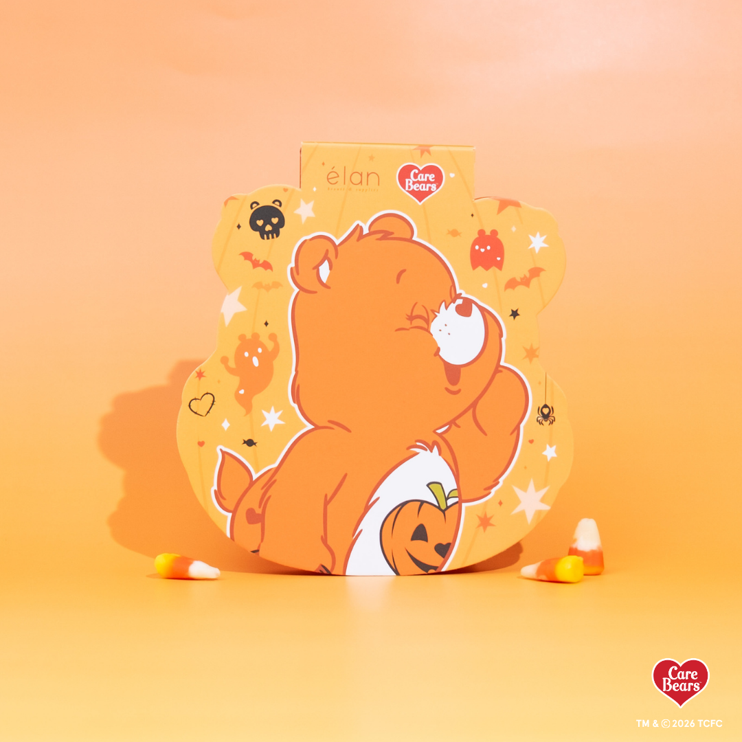 Élan Beauté x Care Bears Halloween packaging featuring an orange Care Bear with a jack-o’-lantern on an orange background.