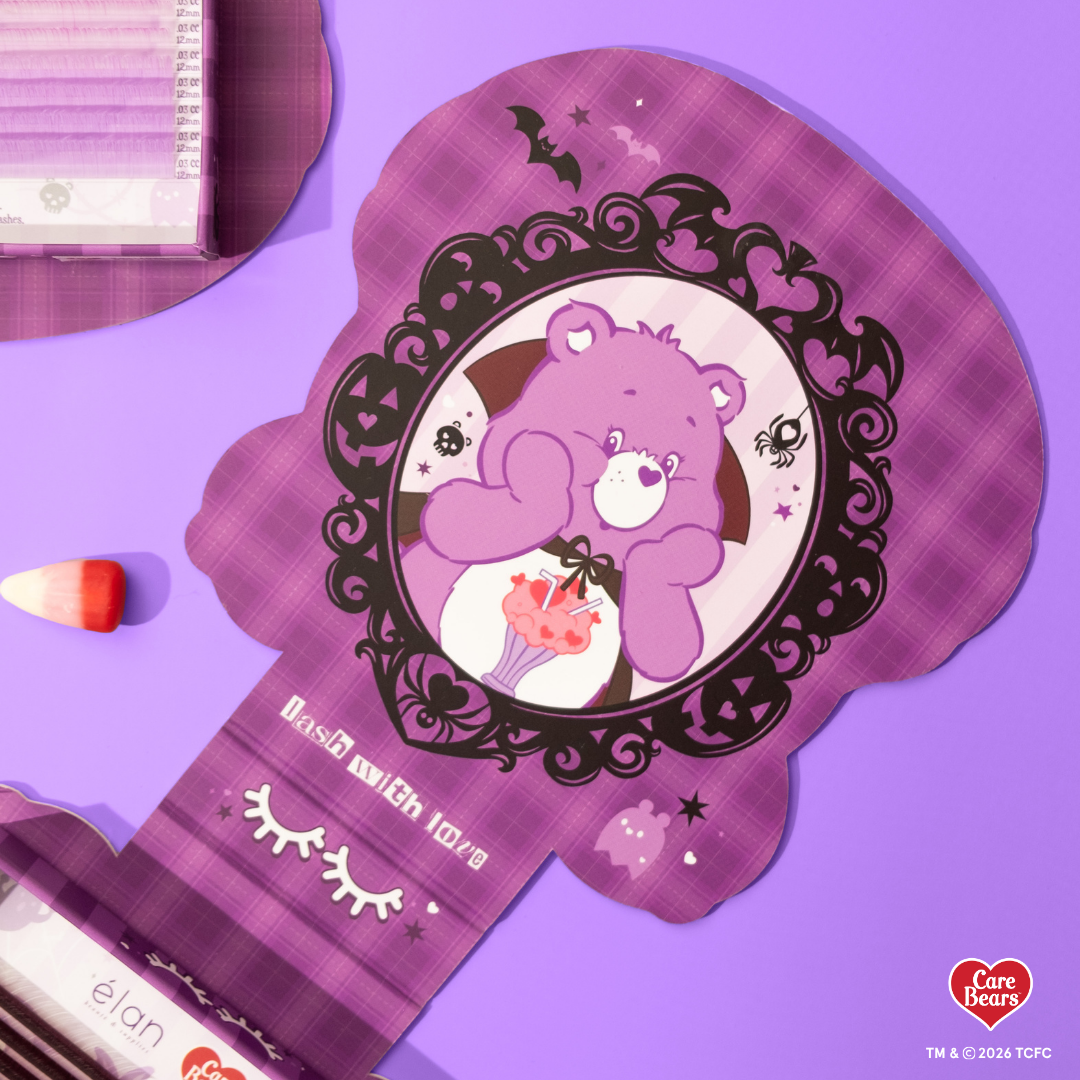 Élan Beauté x Care Bears Share Bear purple Big Boi lash tray in purple Halloween-themed Care Bears packaging with candy corn accents.