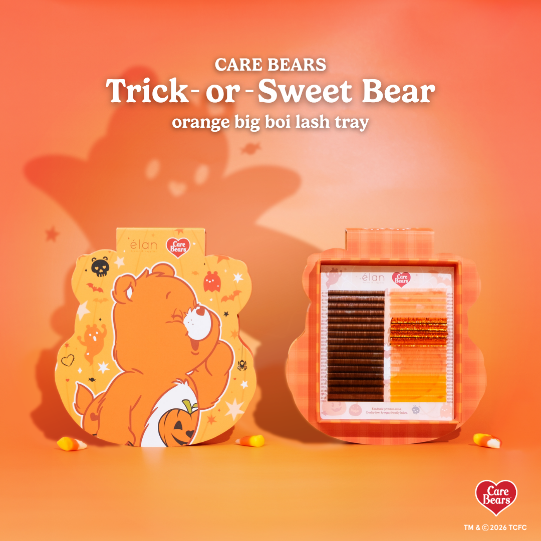Élan Beauté x Care Bears Trick-or-Sweet Bear orange Big Boi lash tray featuring warm brown and orange specialty lashes in Halloween-themed Care Bears packaging with candy corn accents.