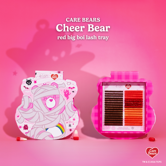 Élan Beauté x Care Bears Cheer Bear red Big Boi lash tray featuring warm brown and red lashes in pink Halloween-themed Care Bears packaging with candy corn accents.