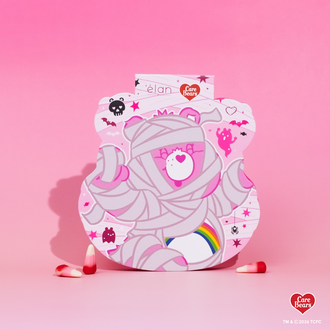 Élan Beauté x Care Bears Cheer Bear Big Boi lash tray in pink Halloween-themed Care Bears packaging with candy corn accents.