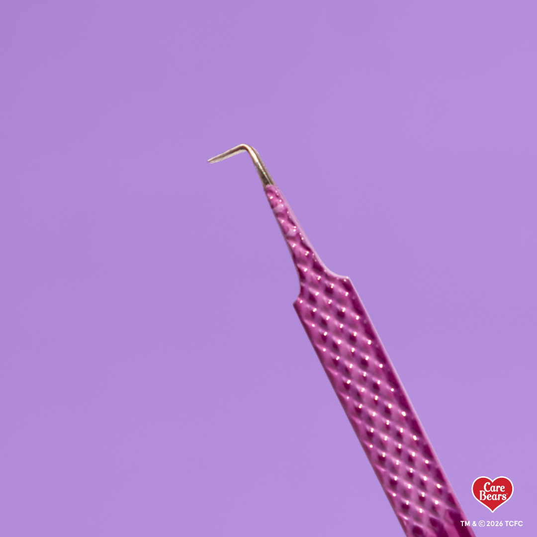 Élan Beauté x Care Bears purple volume tweezer featuring a textured grip and skinny 90-degree angled tip, shown against a purple background.