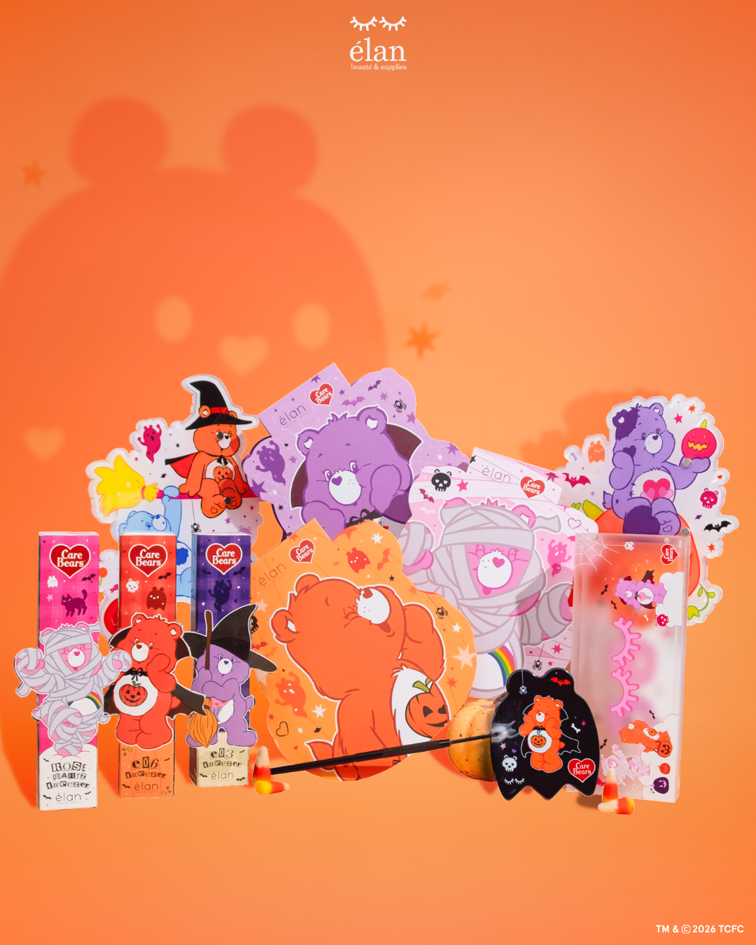 Élan Beauté x Care Bears Halloween collection featuring lash trays, tweezers, magnetic case, XL lash tiles, handheld mirror, and character-themed accessories in orange, pink, and purple seasonal designs.