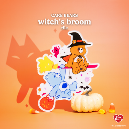 Élan Beauté x Care Bears Witch’s Broom lash tile featuring orange and blue Care Bears riding a broom, surrounded by ghosts, bats, pumpkins, candy, and Halloween accents on a warm orange background.