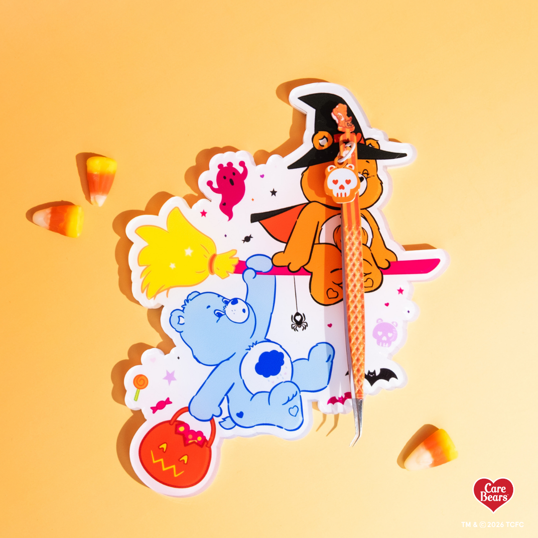 Élan Beauté x Care Bears Halloween lash tile featuring colorful Care Bears characters, pumpkins, ghosts, bats, and candy accents, styled with an orange Halloween tweezer and candy corn on a warm orange background.