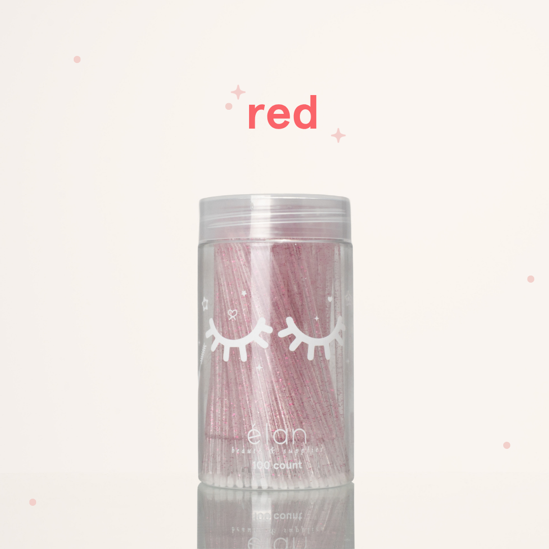 Élan Beauté red glitter microbrush applicator brushes in a clear 100-count container with white eyelash graphics, displayed on a soft cream background with red accents.