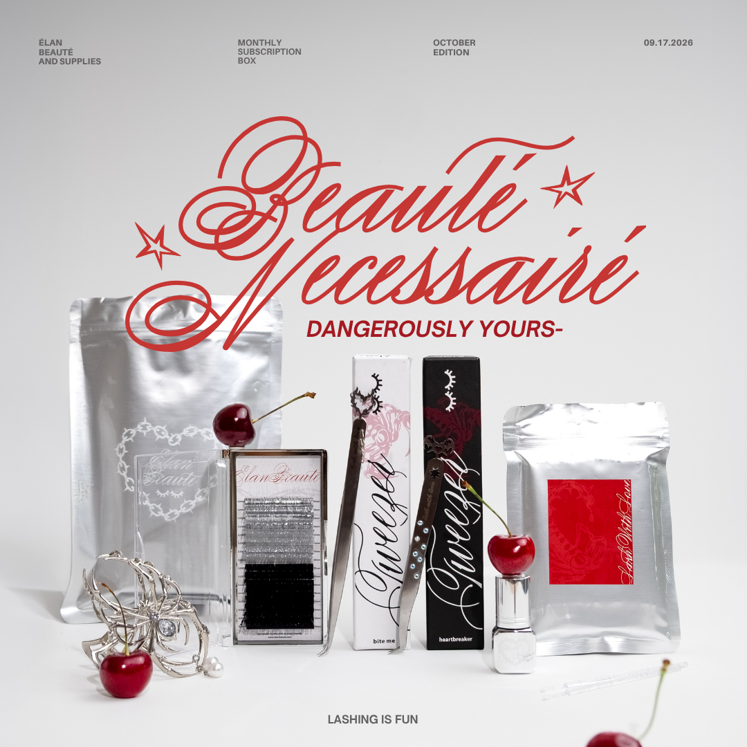 October “Dangerously Yours” subscription box featuring silver and black lash products, Bite Me and Heartbreaker tweezers, lash adhesive, microbrushes, spider hair claw clip, cherries, and metallic packaging on a white background.