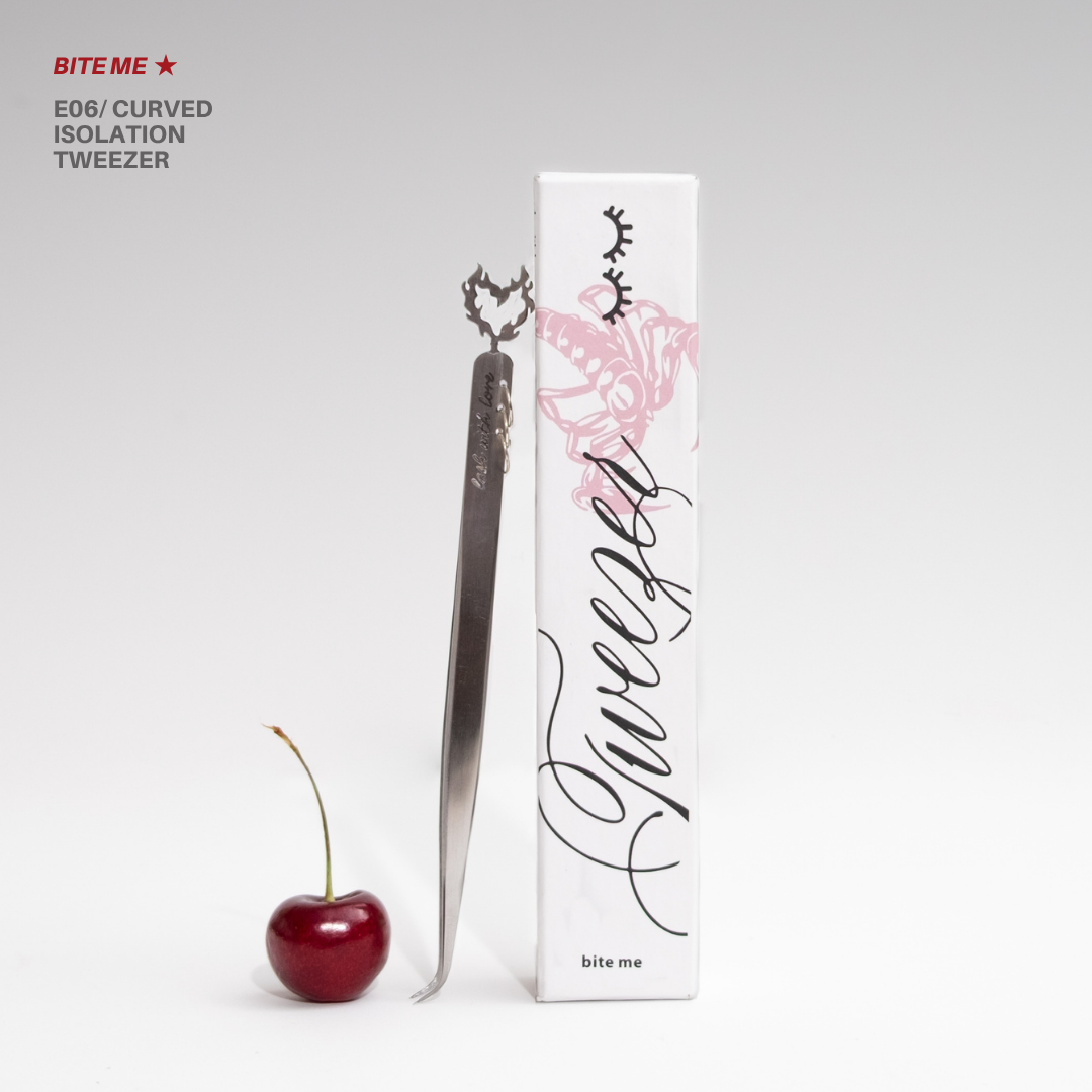 Bite Me E06 curved isolation tweezer with matching white rose-themed packaging, styled beside a red cherry on a clean white background.