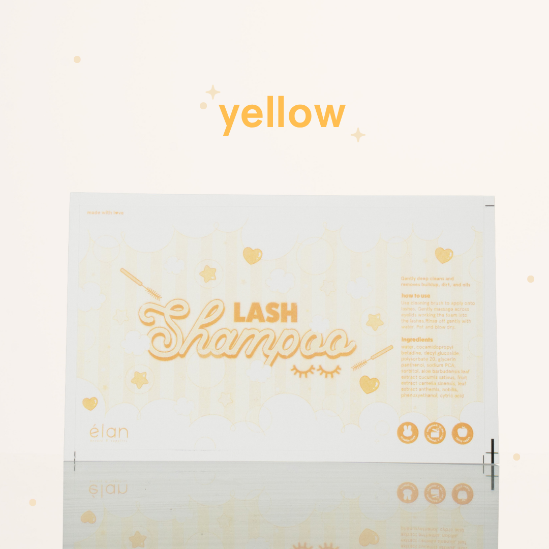 Yellow lash shampoo label featuring a soft pastel bubble design, lash shampoo branding, usage instructions, ingredients, and product icons on a cream background.