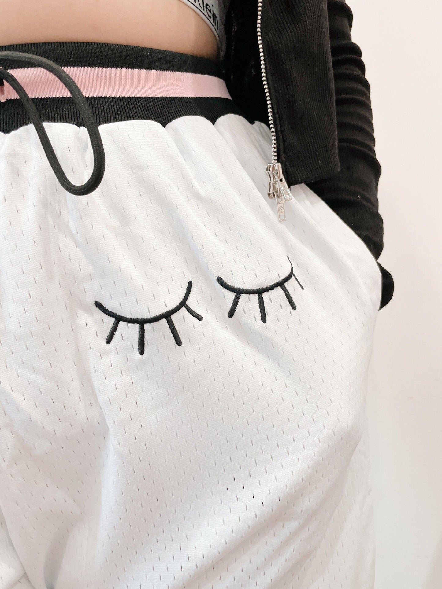 white embroidered basketball shorts