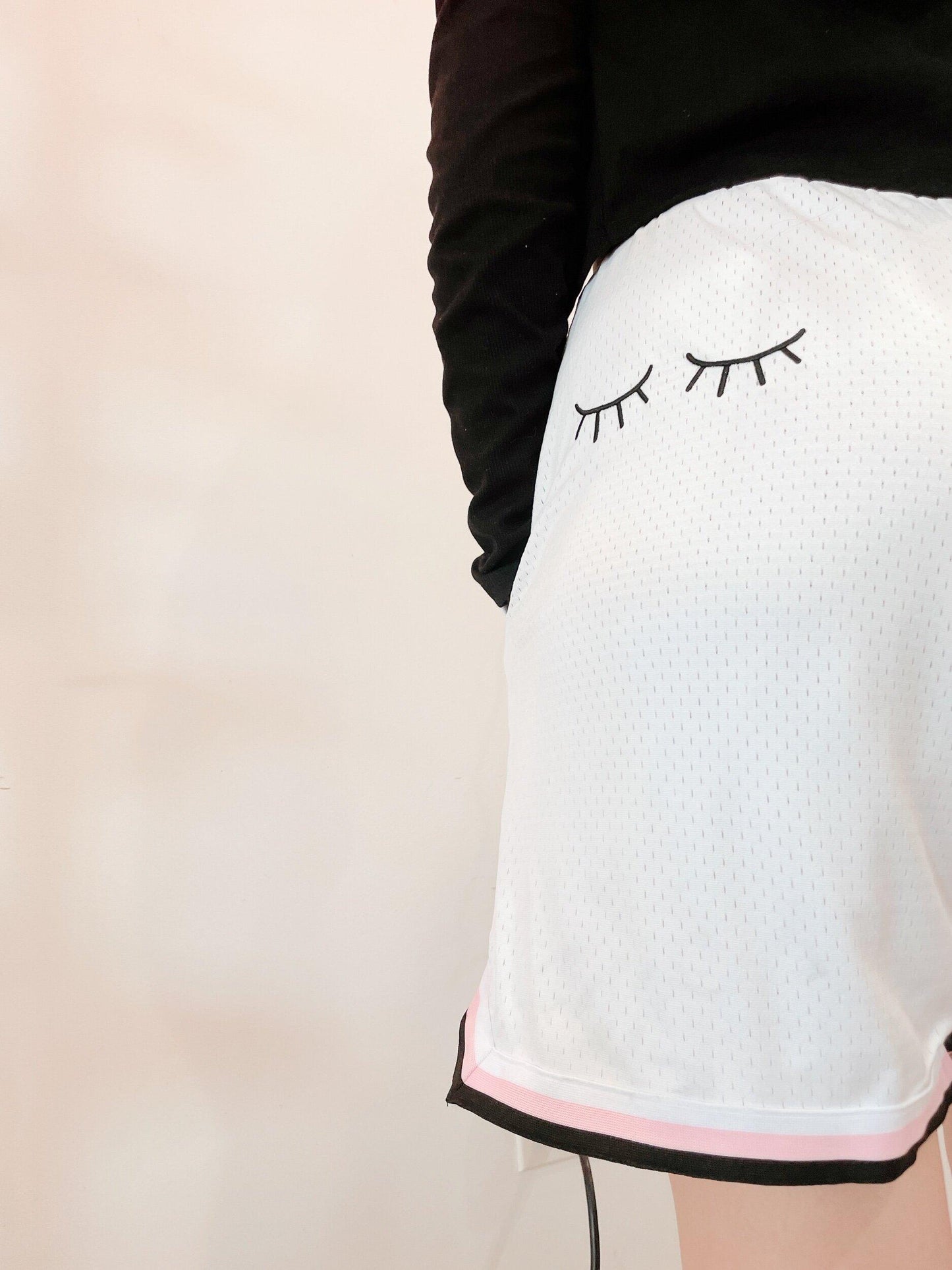 white embroidered basketball shorts